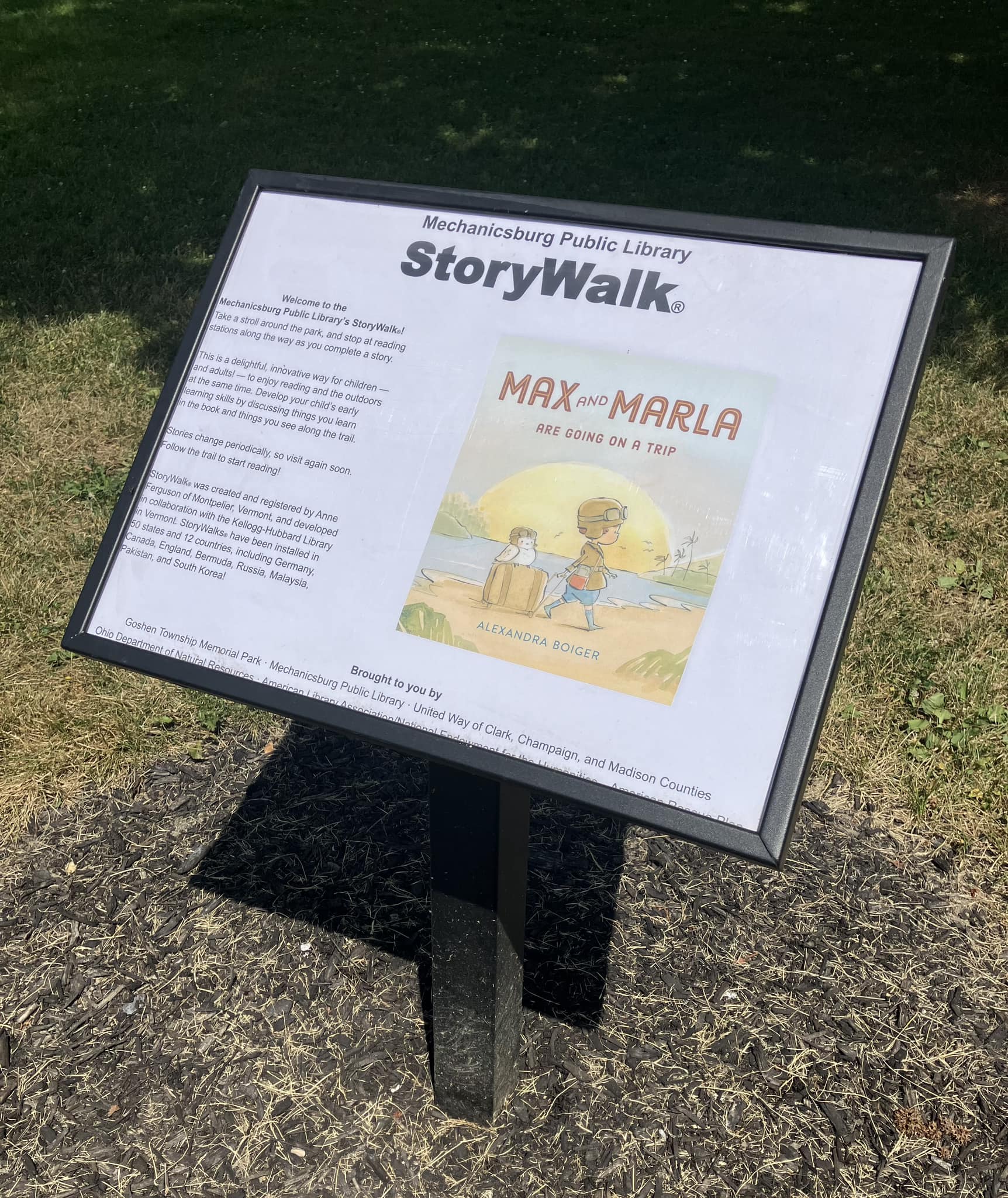 StoryWalk sign post for the book Max and Marla are Going on a Trip