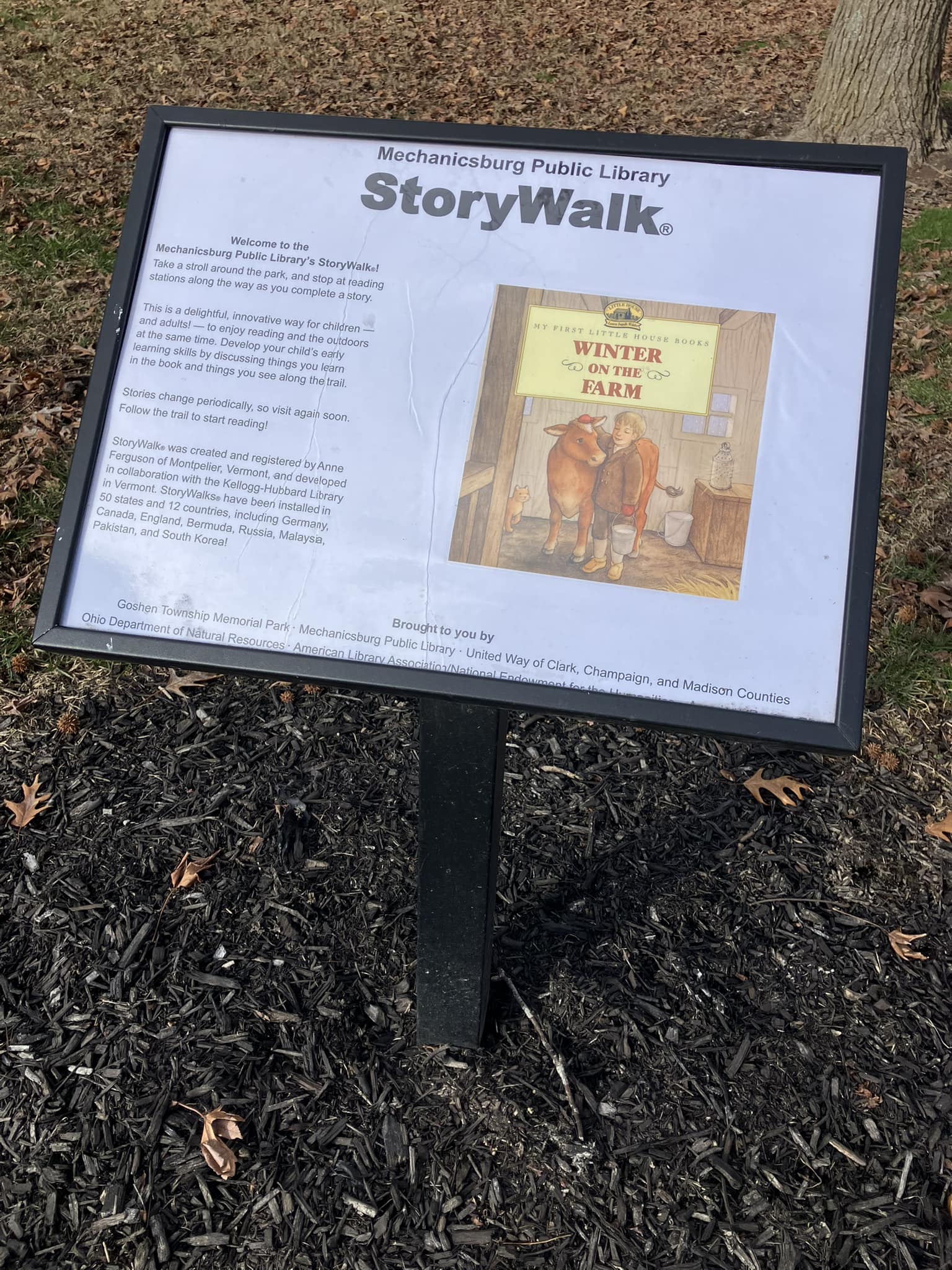 StoryWalk signpost for the book Winter on the Farm